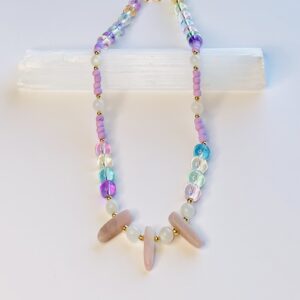 A necklace with wooden beads and glass beads.