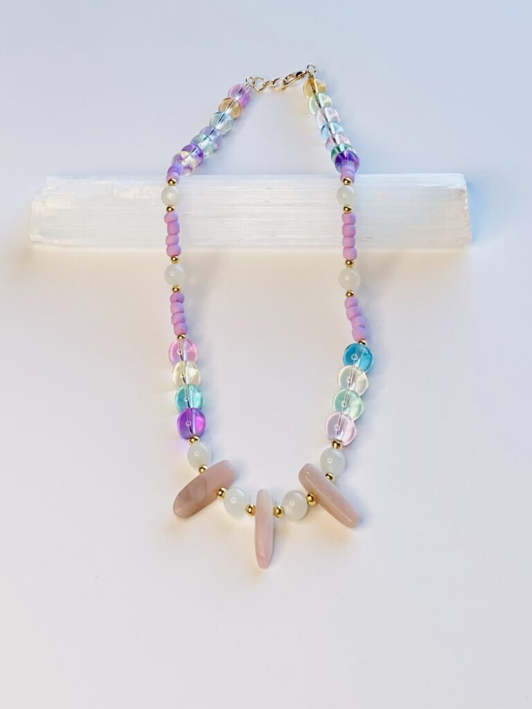 A necklace with wooden beads and glass beads.