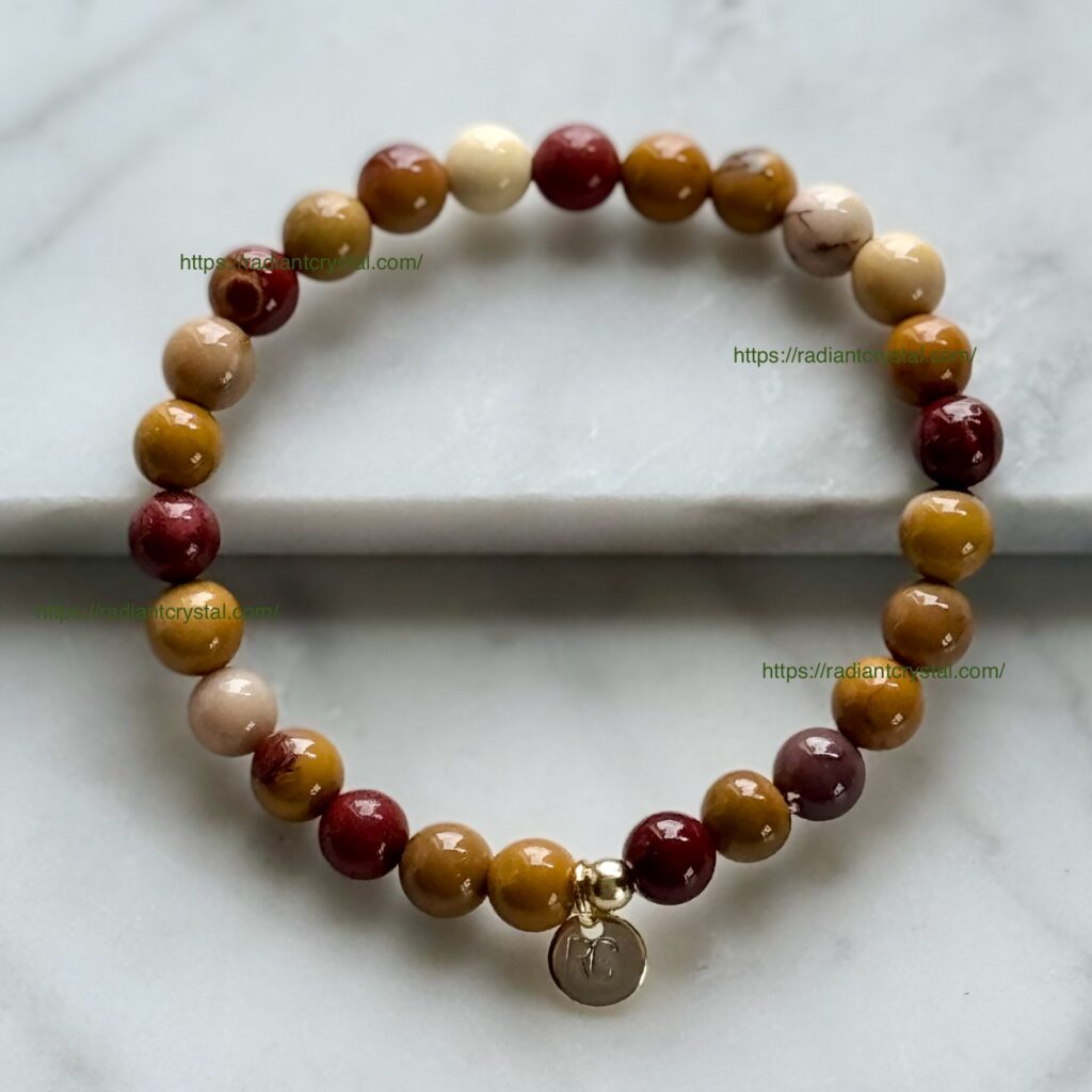 Multicolored stone beaded bracelet with charm.