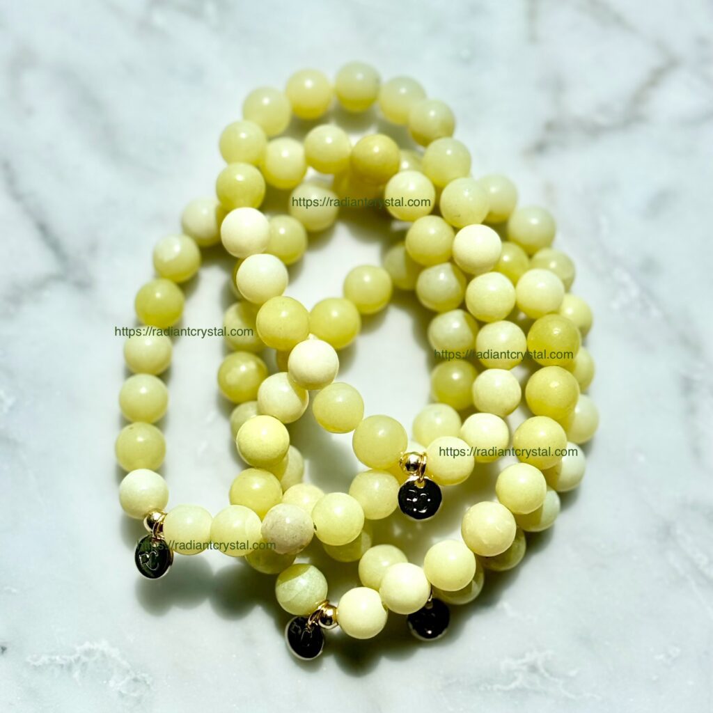 Yellow jade bead bracelets with charms.