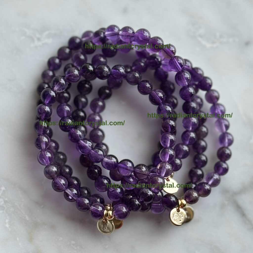 Amethyst beaded bracelets with gold charms.