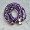Amethyst beaded bracelets with charms.