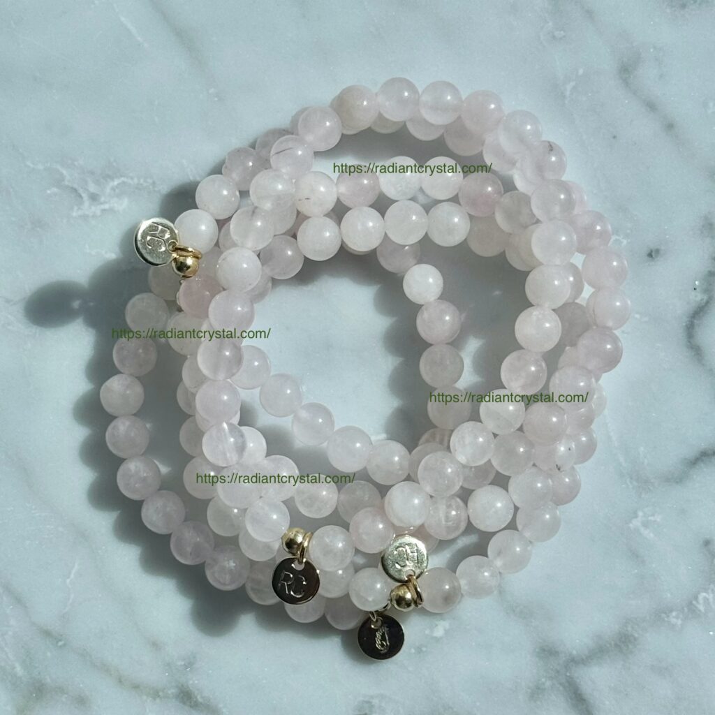 Pink quartz beaded bracelets with charms.