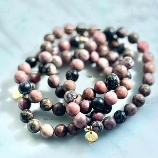 Pink and black gemstone beaded bracelets.