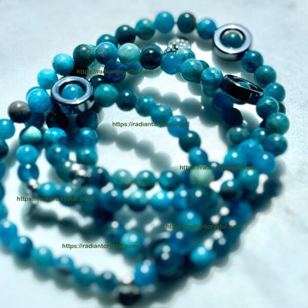 Blue apatite beaded bracelet with charms.