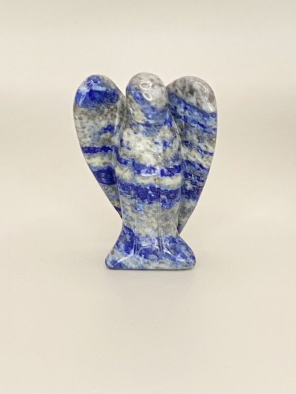 A Lapis Lazuli Angel figurine on a white surface.