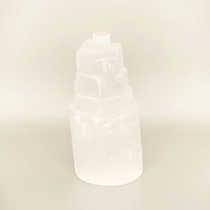 A Selenite Tower sitting on a table.