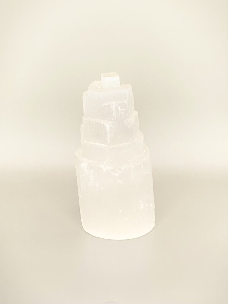 A Selenite Tower sitting on a table.