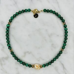 A green Malachite & Pearl Choker with a gold clasp.