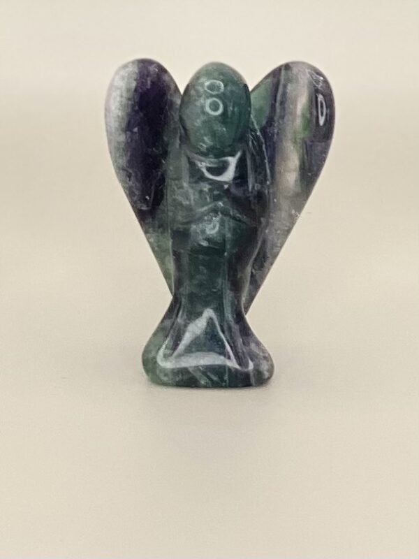 Green and purple fluorite angel figurine.