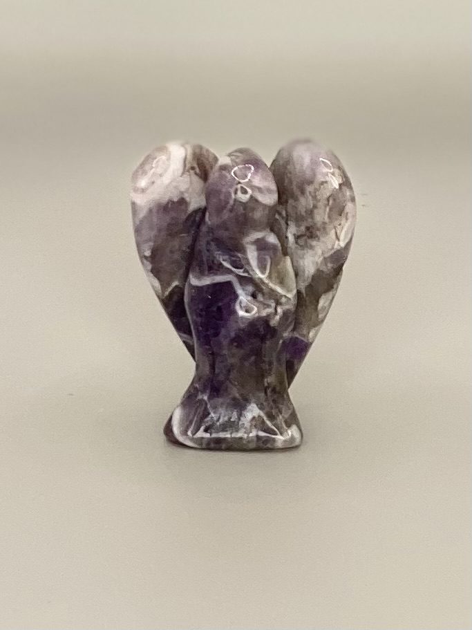 Amethyst carved angel figurine.