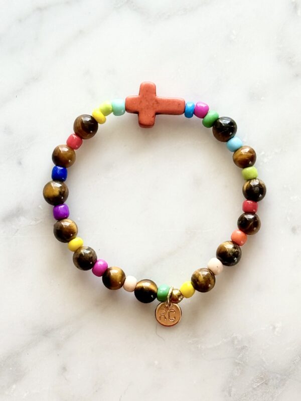 Colorful beaded bracelet with cross charm.