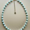 Pearl and green stone beaded necklace.