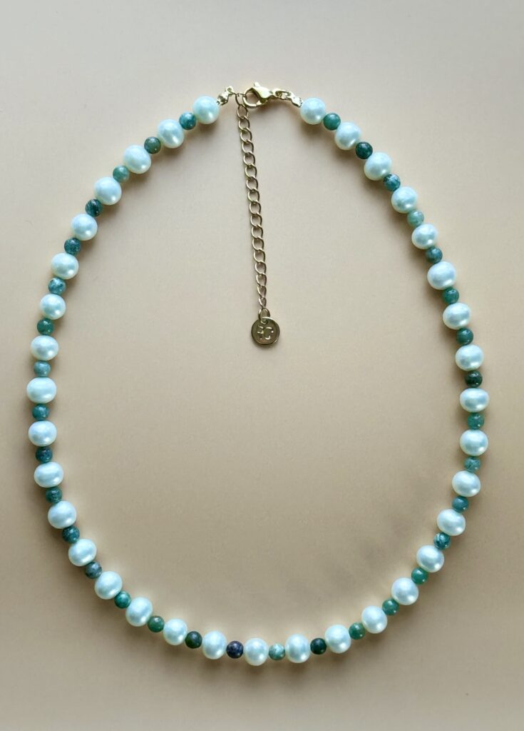 Pearl and green stone beaded necklace.