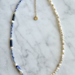 Blue and white pearl necklace with gold star.