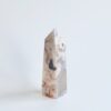 White and brown agate crystal point.