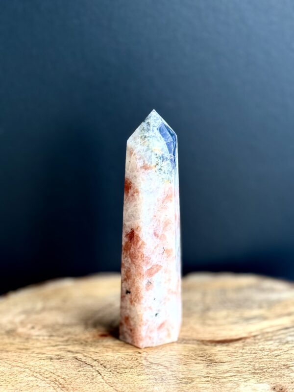 Orange and white sunstone crystal point.