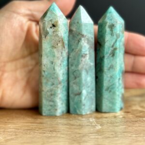 Three green amazonite crystal points.