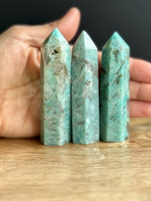 Three green amazonite crystal points.