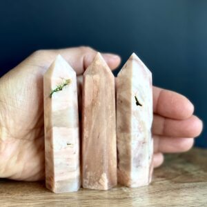 Three pink and white crystal points.