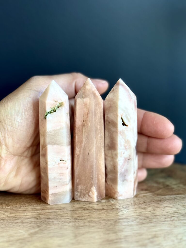 Three pink and white crystal points.