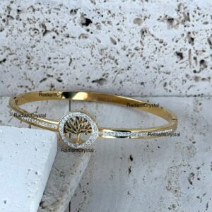 Gold bangle bracelet with tree of life.
