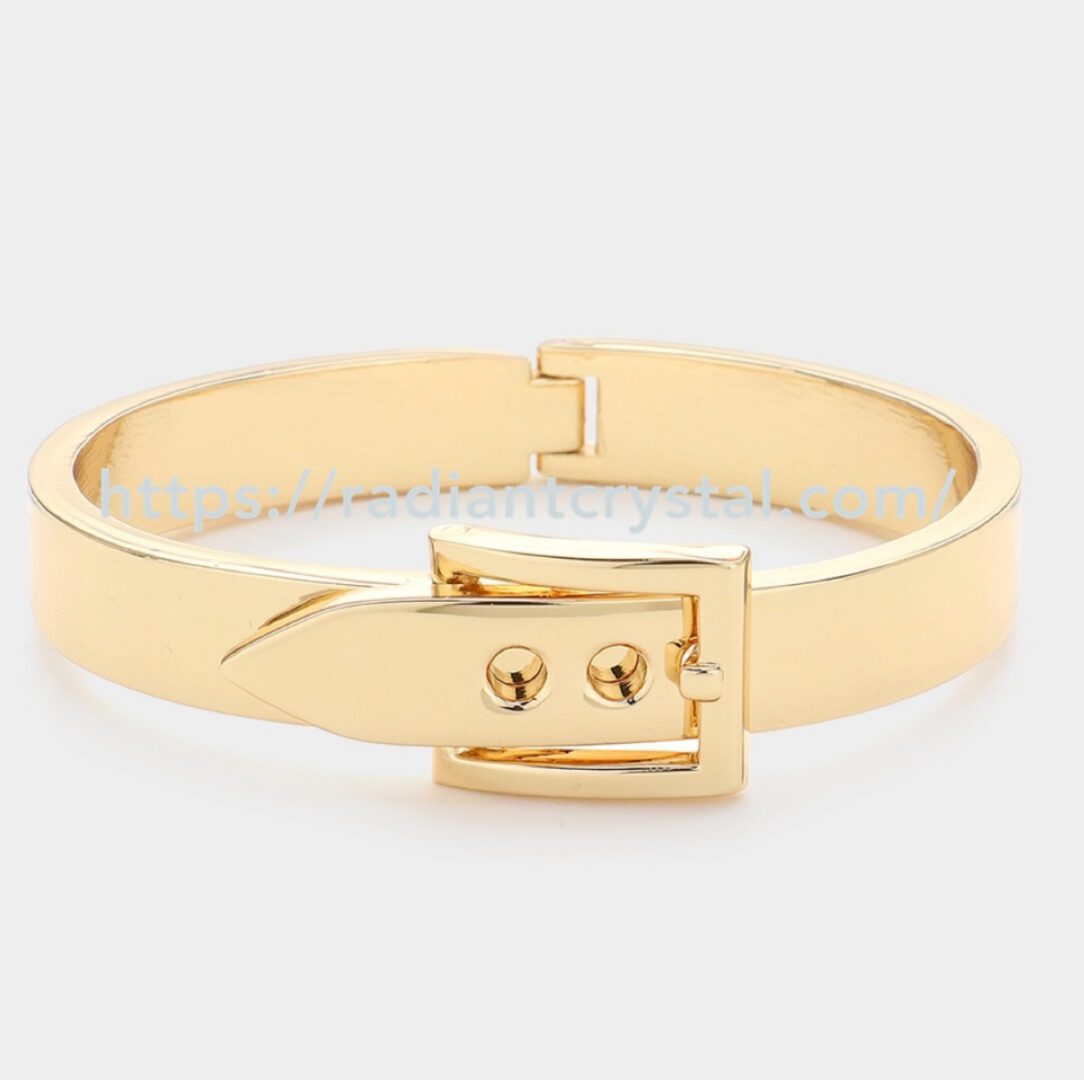 Gold bangle bracelet with buckle closure.