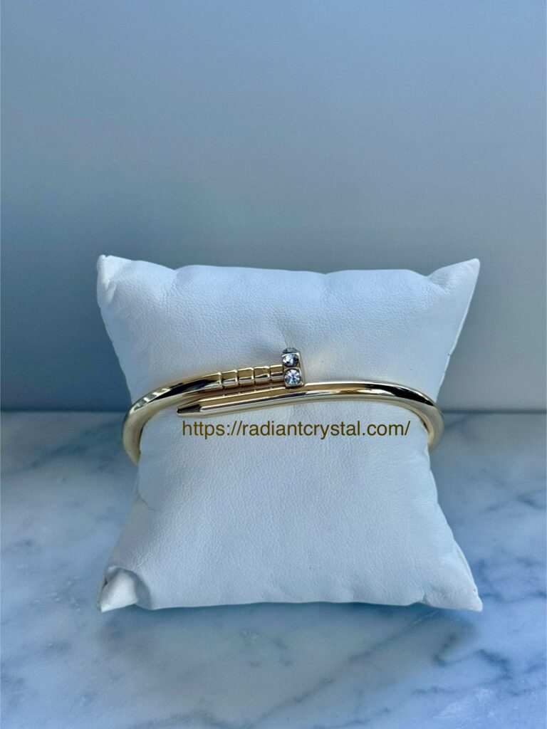 Gold bangle with crystal accents.