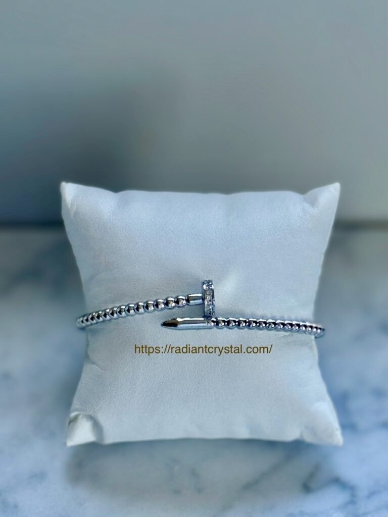 Silver nail bracelet with diamonds.