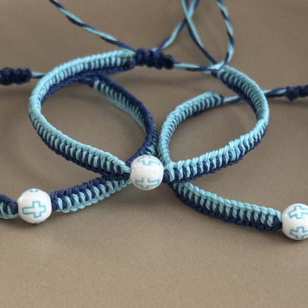 Blue and white cross bracelets.