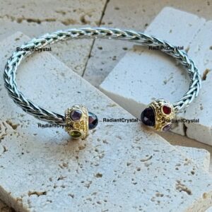 Multi gemstone braided silver bangle bracelet.