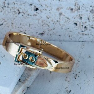 Gold belt buckle bangle bracelet.