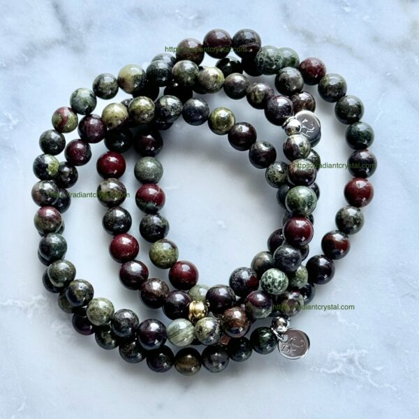 Green, red, and black beaded bracelets.