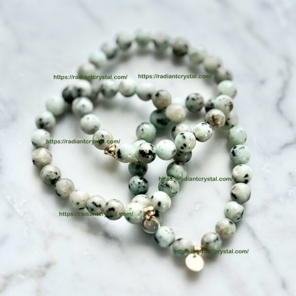 Green and white stone beaded bracelets.