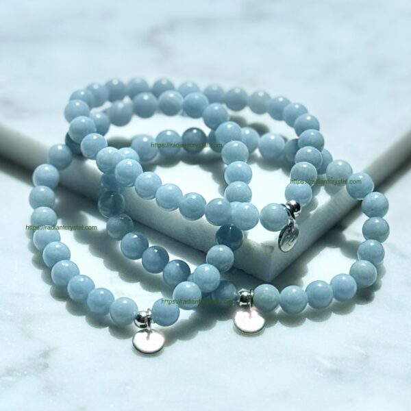 Three blue aquamarine bead bracelets.