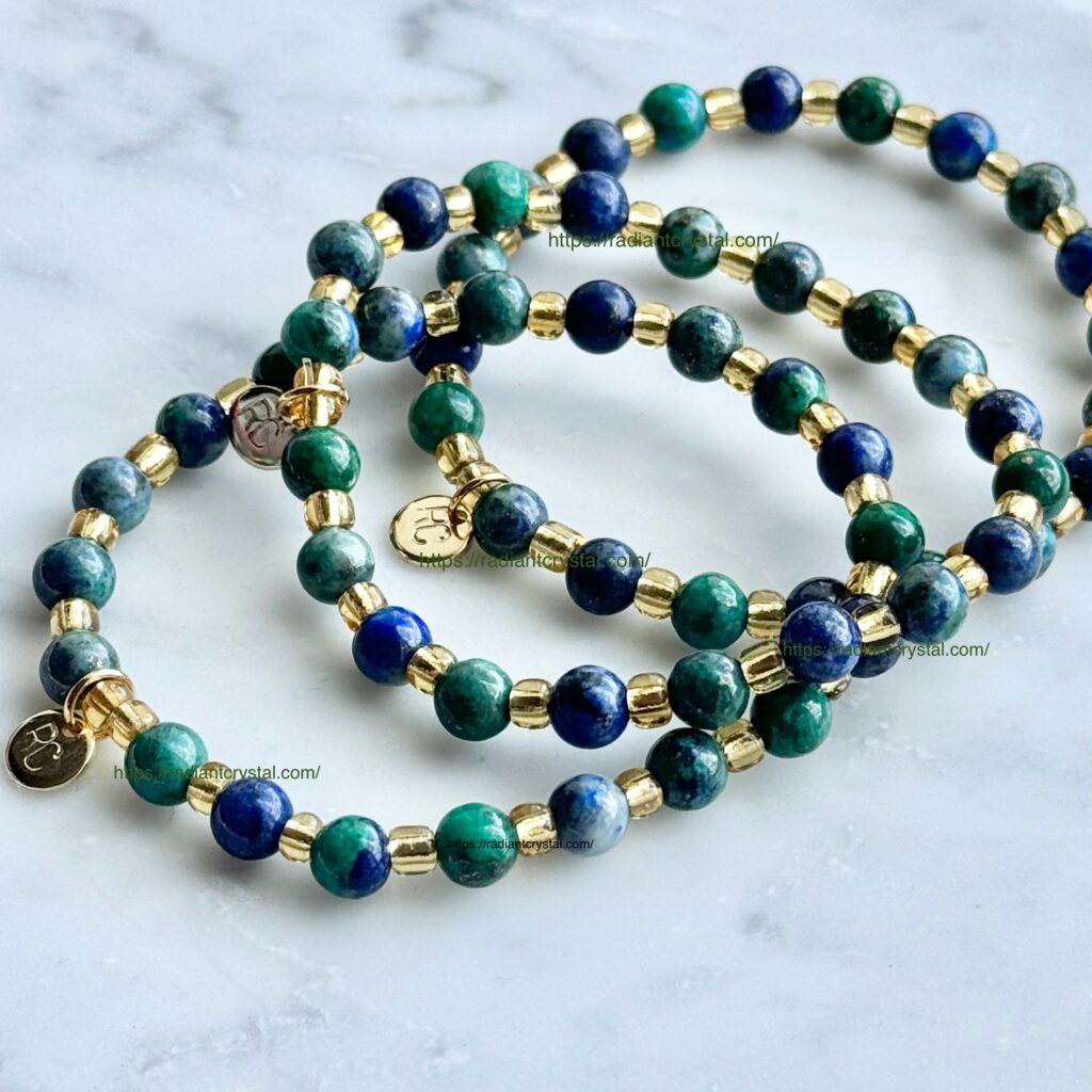 Three blue and green beaded bracelets.