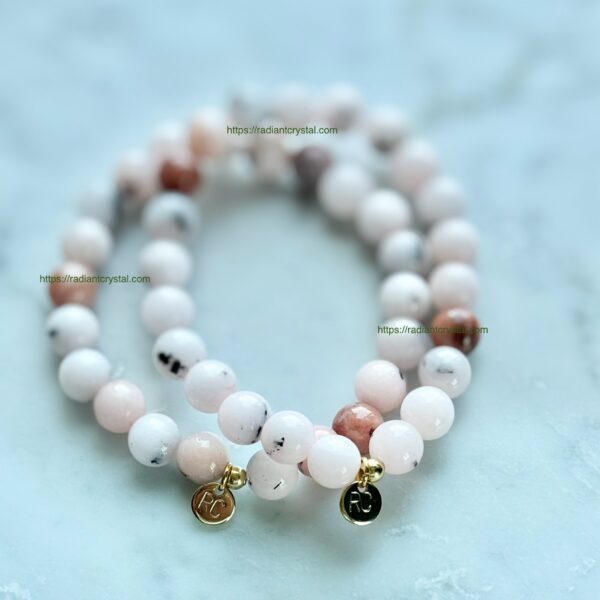 Pink and white gemstone beaded bracelets.