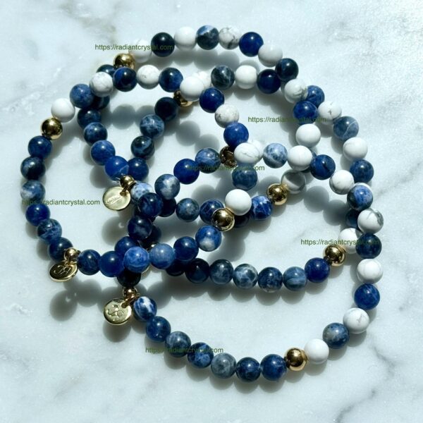 Blue and white beaded bracelets with gold accents.