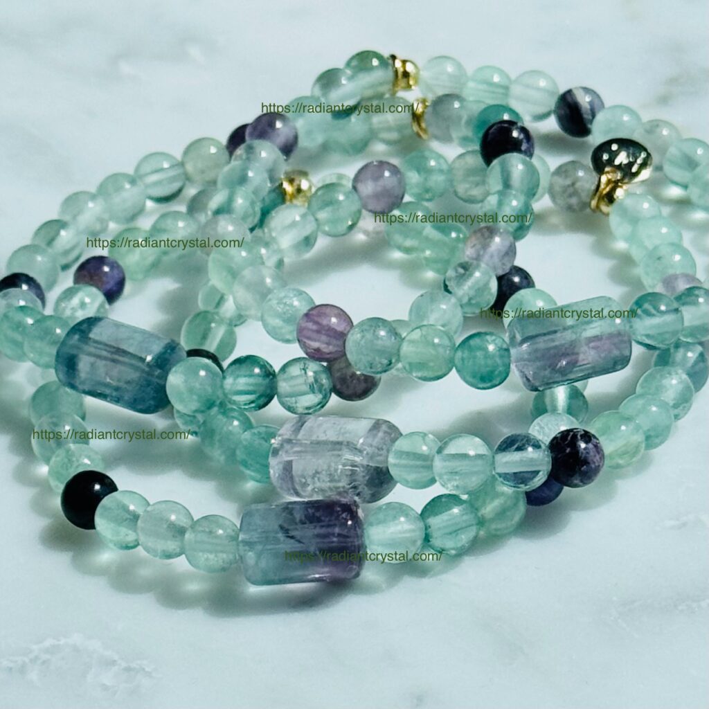 Green fluorite beaded bracelets with gold accents.