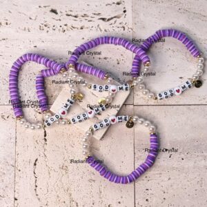 Purple beaded bracelets with "God loves me."