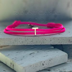 Pink string bracelet with silver T charm.