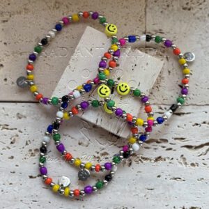 Colorful beaded bracelets with smiley faces.