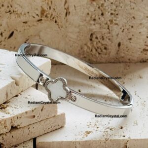 Silver bangle bracelet with clover charm.