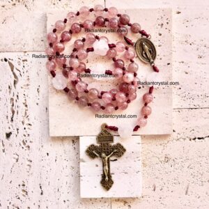 Pink quartz rosary with crucifix.