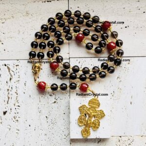 Smoky quartz rosary with gold crucifix.