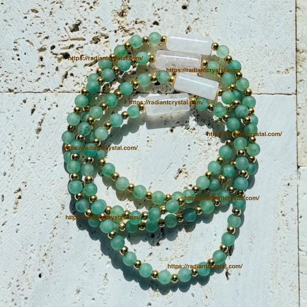 Green beaded necklaces on textured background.