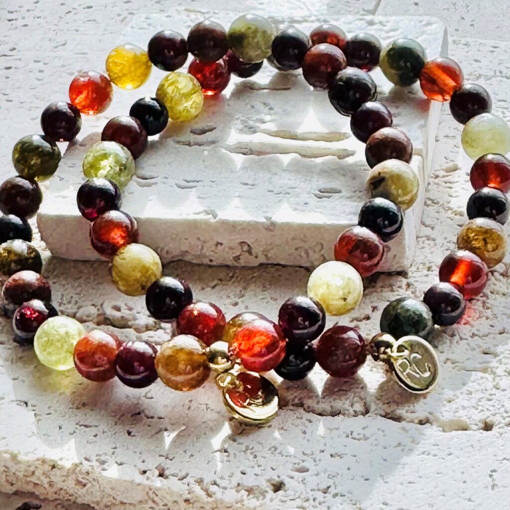 Colorful bead bracelet with gold charm.